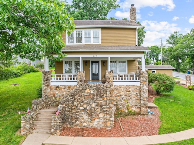 120 N 4th St, Branson, MO 65616 - view of front facade featuring a chimney, a porch, a front lawn, stone siding, and stairs