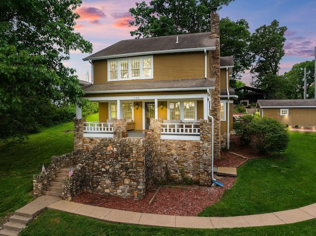 120 N 4th St, Branson, MO 65616 - view of front of house featuring a porch, a chimney, a yard, and stairs