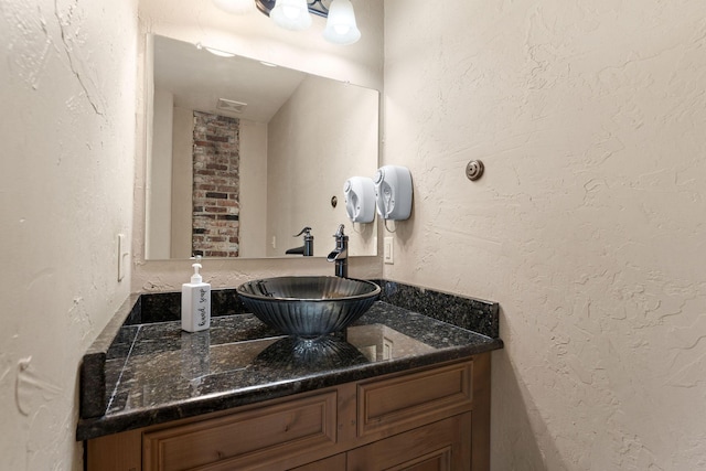 120 N 4th St, Branson, MO 65616 - bathroom with vanity and a textured wall