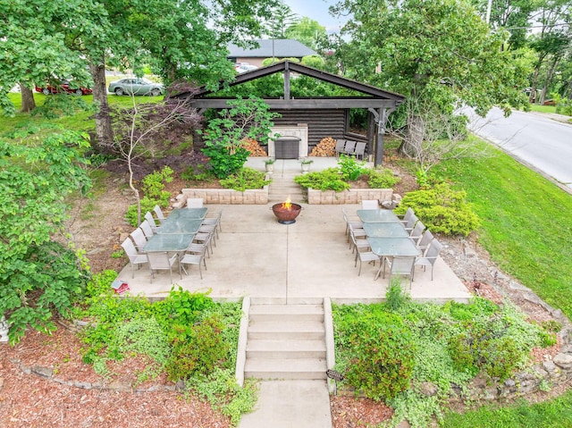 120 N 4th St, Branson, MO 65616 - view of patio featuring an outdoor fire pit, a gazebo, outdoor dining area, and stairway
