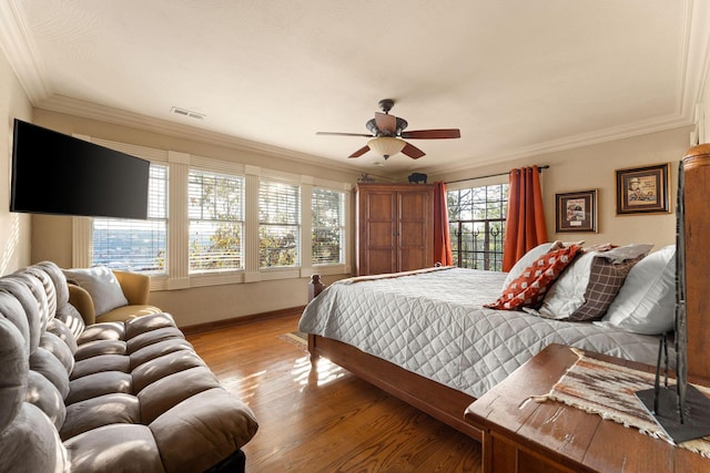120 N 4th St, Branson, MO 65616 - bedroom featuring light wood finished floors, ornamental molding, and a ceiling fan