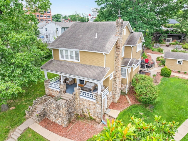120 N 4th St, Branson, MO 65616 - view of front of home featuring stone siding, a shingled roof, a chimney, and a patio