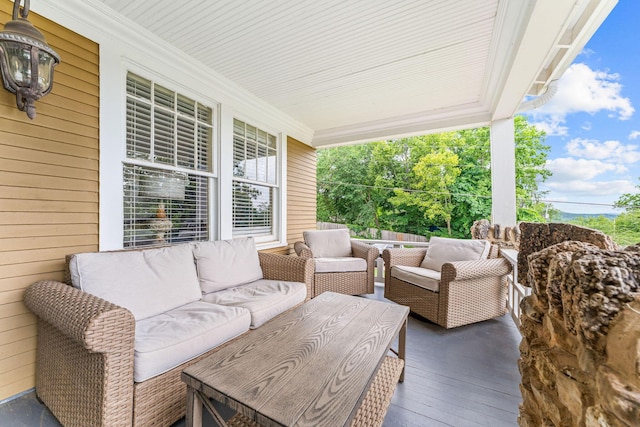 120 N 4th St, Branson, MO 65616 - covered porch featuring outdoor lounge area