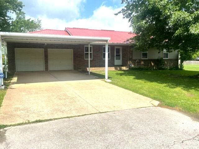 607 Robin Rd, Mountain Grove, MO 65711 - ranch-style house featuring a garage, a front lawn, concrete driveway, and a metal roof