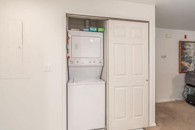 120 Spring Creek Ct Unit B1-U19, Branson, MO 65616 - washroom featuring stacked washer / dryer, electric panel, and light colored carpet