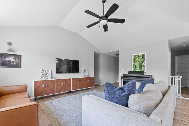 3891 N Spring Branch Ave, Springfield, MO 65803 - living room featuring vaulted ceiling, wood finished floors, and a ceiling fan