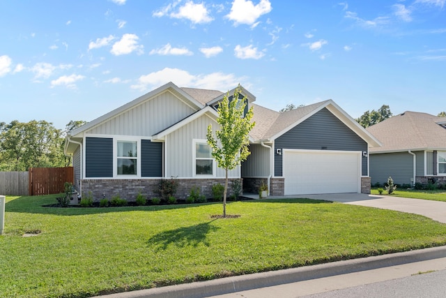3891 N Spring Branch Ave, Springfield, MO 65803 - view of front of house with an attached garage, board and batten siding, concrete driveway, and a shingled roof