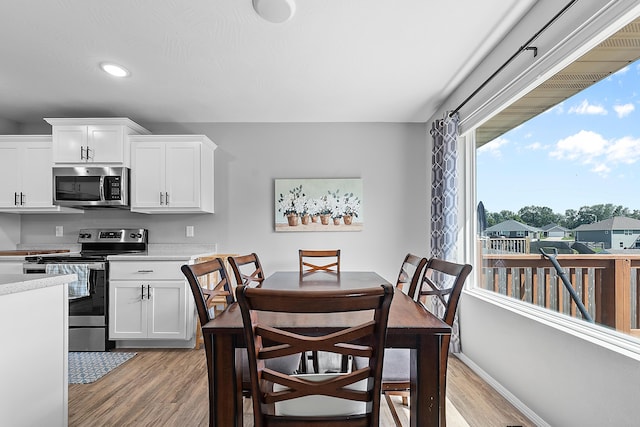 3891 N Spring Branch Ave, Springfield, MO 65803 - dining area with light wood-style flooring and recessed lighting
