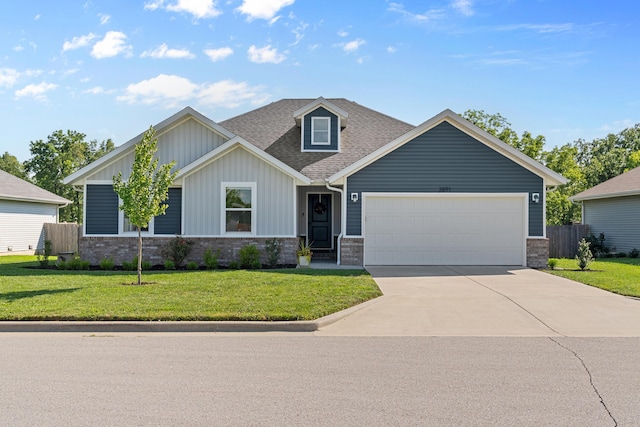 3891 N Spring Branch Ave, Springfield, MO 65803 - view of front of property featuring an attached garage, concrete driveway, brick siding, board and batten siding, and roof with shingles