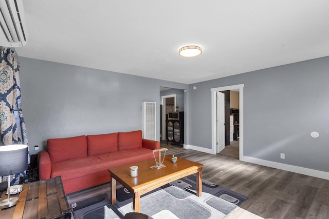 2019 N Rogers Ave, Springfield, MO 65803 - living room with wood finished floors, a wall unit AC, and a heating unit