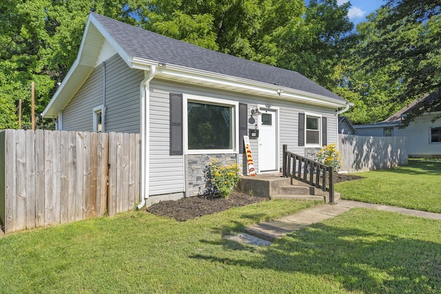 2019 N Rogers Ave, Springfield, MO 65803 - view of front facade with a shingled roof and stone siding