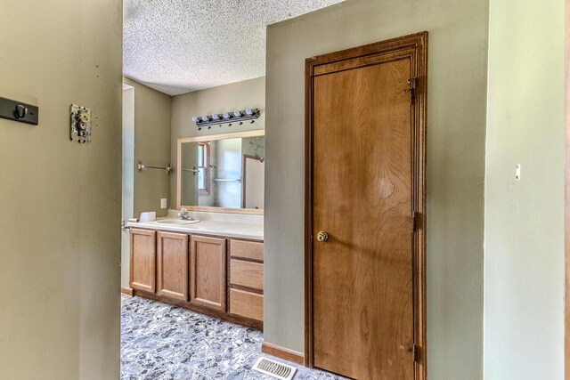 30274 State Highway Bb, Lebanon, MO 65536 - bathroom featuring a textured ceiling and vanity
