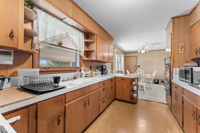 25720 Hillcrest Dr, Shell Knob, MO 65747 - kitchen featuring open shelves, appliances with stainless steel finishes, light countertops, a peninsula, and a ceiling fan