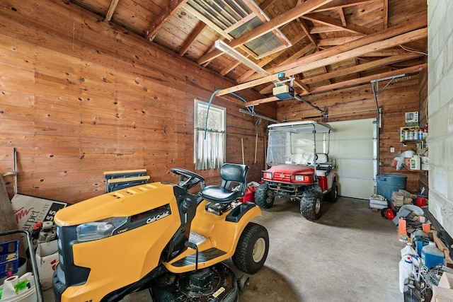 25720 Hillcrest Dr, Shell Knob, MO 65747 - garage featuring wood walls, a garage door opener, and wooden ceiling