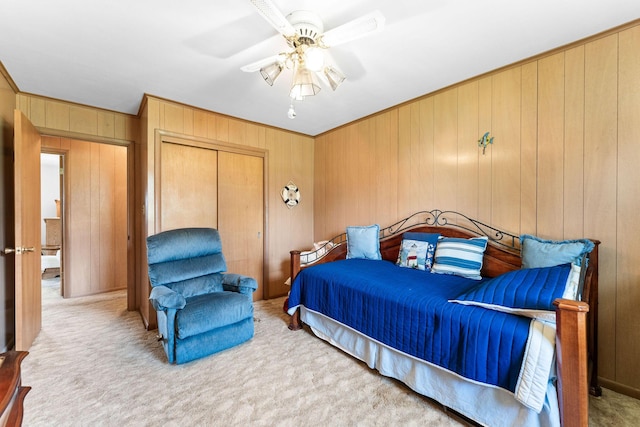 25720 Hillcrest Dr, Shell Knob, MO 65747 - bedroom with wooden walls, carpet, a closet, a ceiling fan, and crown molding