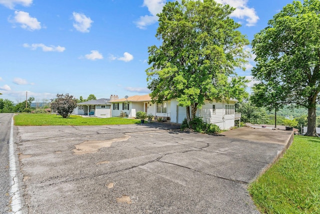 25720 Hillcrest Dr, Shell Knob, MO 65747 - view of front of property with asphalt driveway and a front lawn