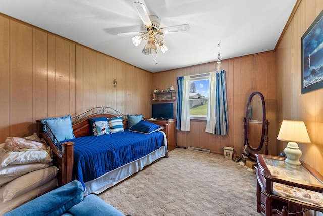 25720 Hillcrest Dr, Shell Knob, MO 65747 - carpeted bedroom with wood walls and ceiling fan