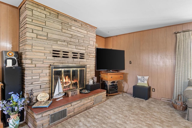25720 Hillcrest Dr, Shell Knob, MO 65747 - living room with carpet flooring, a stone fireplace, and wood walls