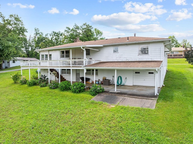 25720 Hillcrest Dr, Shell Knob, MO 65747 - back of house featuring a wooden deck, a patio area, an attached garage, and a yard