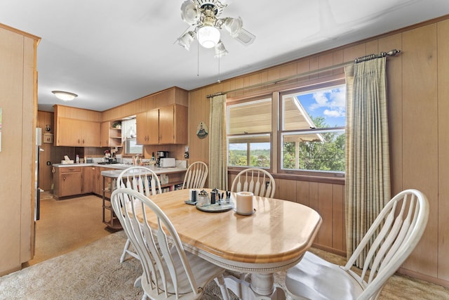 25720 Hillcrest Dr, Shell Knob, MO 65747 - dining area with ceiling fan and wood walls