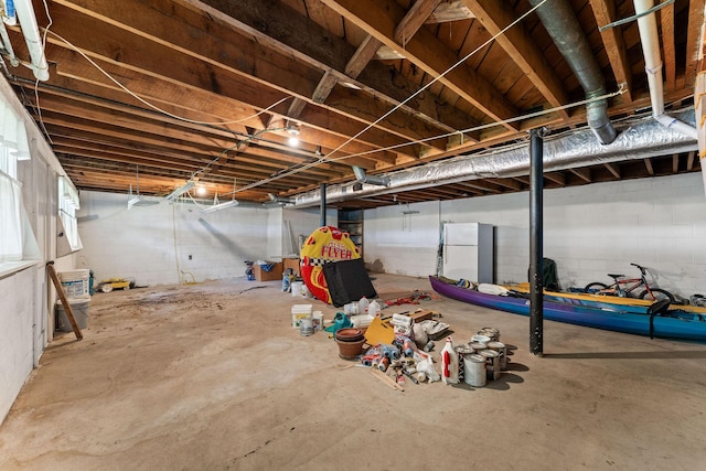 25720 Hillcrest Dr, Shell Knob, MO 65747 - unfinished basement featuring freestanding refrigerator and concrete block wall