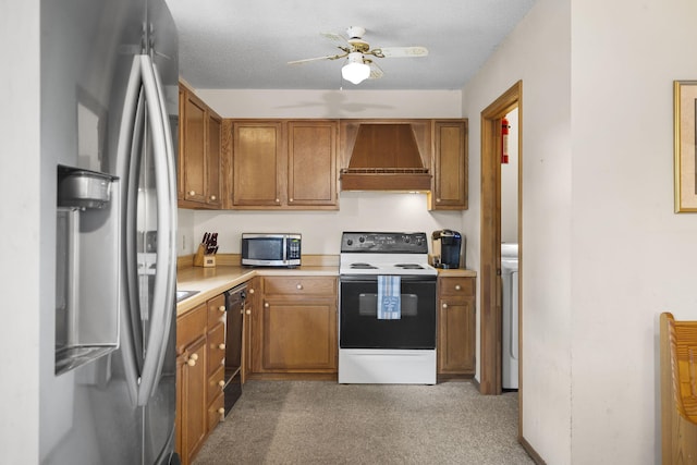 310 Turtle Cove Ln, Reeds Spring, MO 65737 - kitchen with stainless steel appliances, custom range hood, light countertops, light carpet, and brown cabinetry