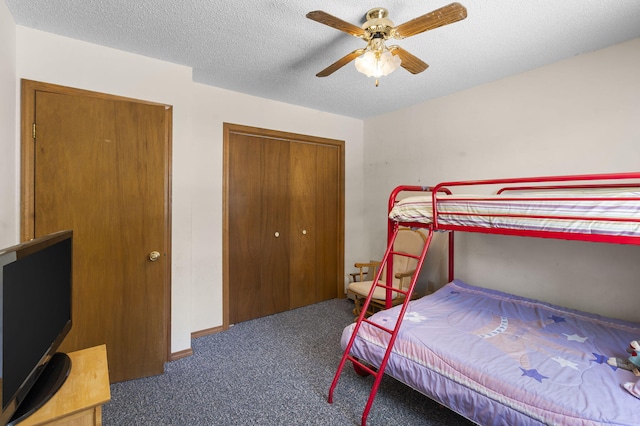 310 Turtle Cove Ln, Reeds Spring, MO 65737 - carpeted bedroom featuring a closet, ceiling fan, and a textured ceiling