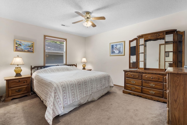 310 Turtle Cove Ln, Reeds Spring, MO 65737 - carpeted bedroom with a textured ceiling and a ceiling fan