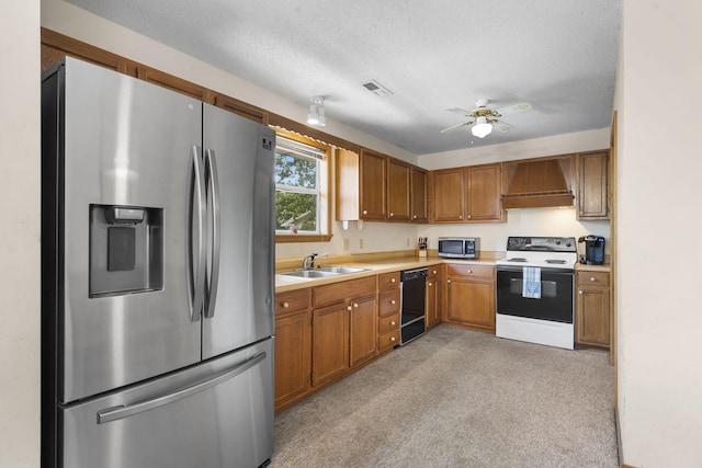 310 Turtle Cove Ln, Reeds Spring, MO 65737 - kitchen featuring stainless steel appliances, custom range hood, light countertops, a ceiling fan, and light carpet