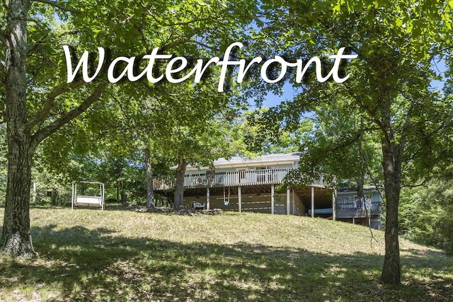 310 Turtle Cove Ln, Reeds Spring, MO 65737 - view of green lawn featuring a wooden deck
