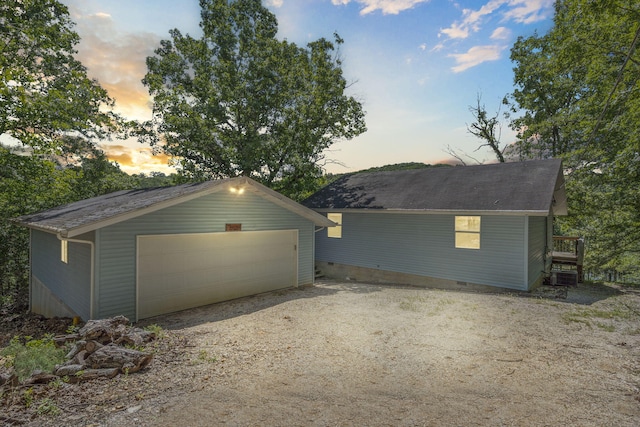 310 Turtle Cove Ln, Reeds Spring, MO 65737 - garage at dusk with a garage