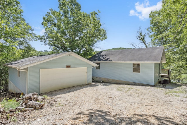 310 Turtle Cove Ln, Reeds Spring, MO 65737 - rear view of property with a detached garage, an outdoor structure, crawl space, and a shingled roof