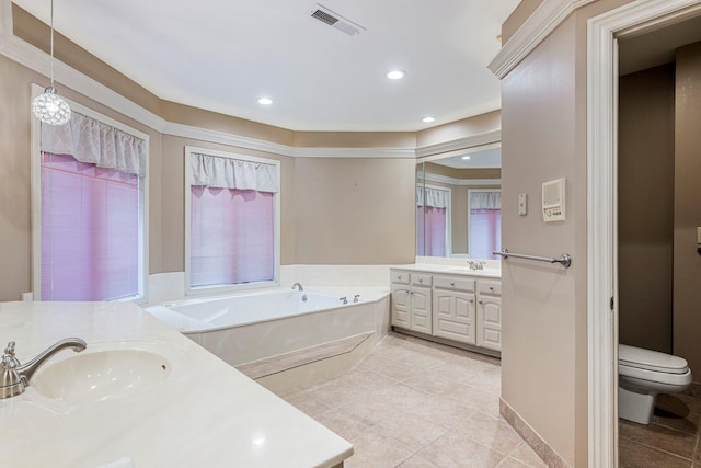 2347 E Nottingham St, Springfield, MO 65804 - bathroom with two vanities, a garden tub, tile patterned floors, and recessed lighting