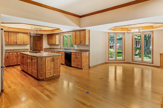 2347 E Nottingham St, Springfield, MO 65804 - kitchen featuring black dishwasher, crown molding, light wood finished floors, a chandelier, and brown cabinetry