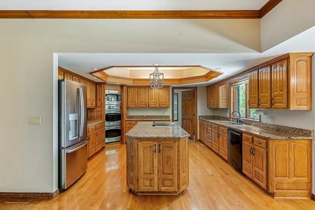 2347 E Nottingham St, Springfield, MO 65804 - kitchen featuring black appliances, crown molding, a tray ceiling, brown cabinets, and light wood-type flooring