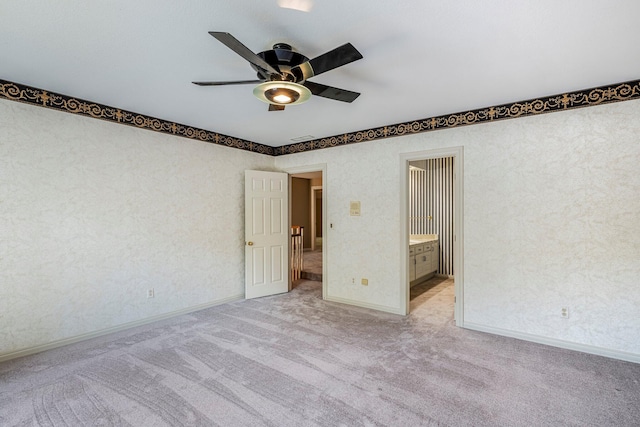 2347 E Nottingham St, Springfield, MO 65804 - unfurnished bedroom featuring light carpet and a ceiling fan