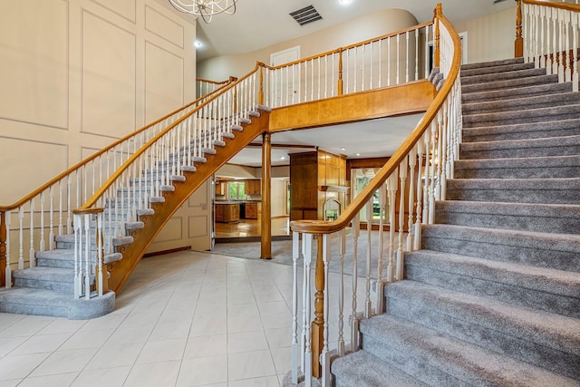 2347 E Nottingham St, Springfield, MO 65804 - staircase with a high ceiling, tile patterned floors, and recessed lighting