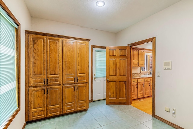 2347 E Nottingham St, Springfield, MO 65804 - unfurnished bedroom featuring multiple windows and light tile patterned floors
