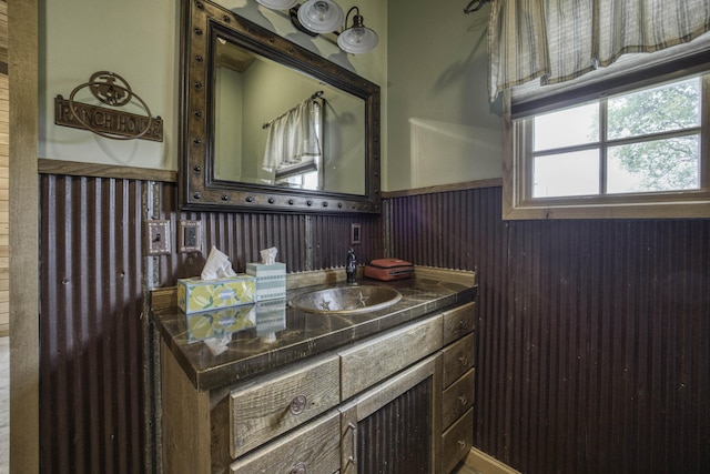 12132 W Farm Road 18, Walnut Grove, MO 65770 - bathroom featuring wainscoting, vanity, and wooden walls