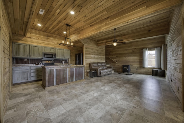 12132 W Farm Road 18, Walnut Grove, MO 65770 - kitchen featuring wood walls, open floor plan, stainless steel appliances, wooden ceiling, and light countertops