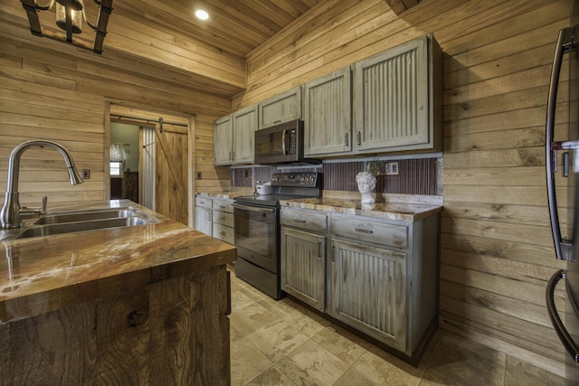 12132 W Farm Road 18, Walnut Grove, MO 65770 - kitchen featuring black range with electric stovetop, butcher block counters, wood walls, a barn door, and wood ceiling