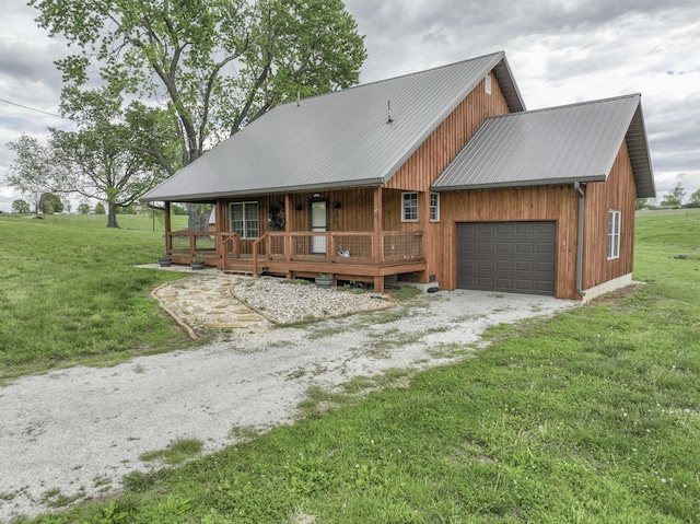 12132 W Farm Road 18, Walnut Grove, MO 65770 - view of front facade featuring a front yard, an attached garage, driveway, and a porch