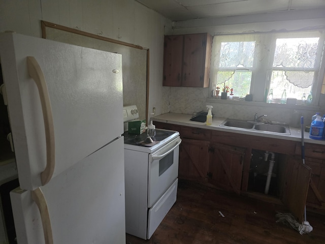 510 W 4th St, Willow Springs, MO 65793 - kitchen with white appliances, dark wood finished floors, light countertops, and brown cabinets