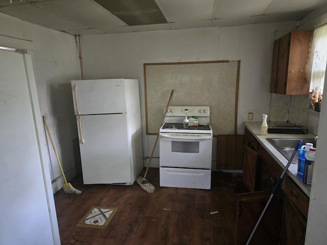 510 W 4th St, Willow Springs, MO 65793 - kitchen featuring white appliances, dark wood-type flooring, and light countertops