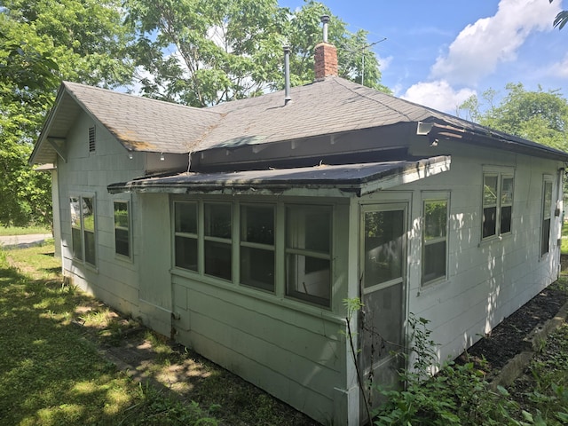510 W 4th St, Willow Springs, MO 65793 - back of property featuring roof with shingles and a chimney
