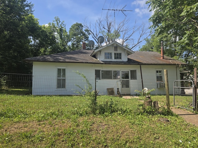 510 W 4th St, Willow Springs, MO 65793 - back of property with a shingled roof and a chimney