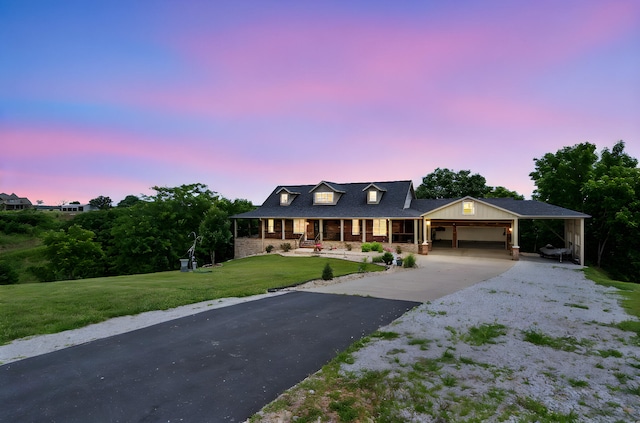 358 Spring View Pl, Reeds Spring, MO 65737 - view of front of home featuring driveway, a front yard, covered porch, a carport, and brick siding