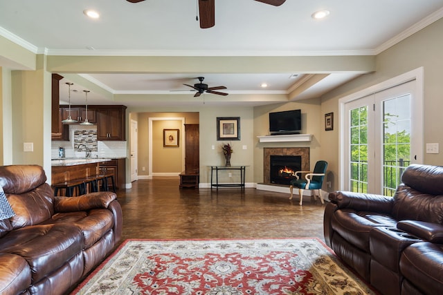 358 Spring View Pl, Reeds Spring, MO 65737 - living area featuring ceiling fan, dark wood-type flooring, a tile fireplace, recessed lighting, and crown molding