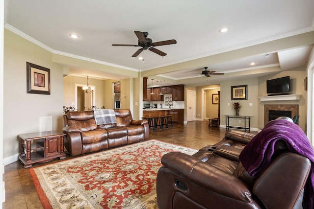 358 Spring View Pl, Reeds Spring, MO 65737 - living room featuring ceiling fan, crown molding, a chandelier, recessed lighting, and a tile fireplace