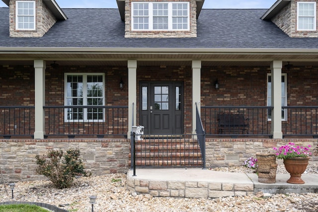 358 Spring View Pl, Reeds Spring, MO 65737 - view of exterior entry featuring a shingled roof and covered porch